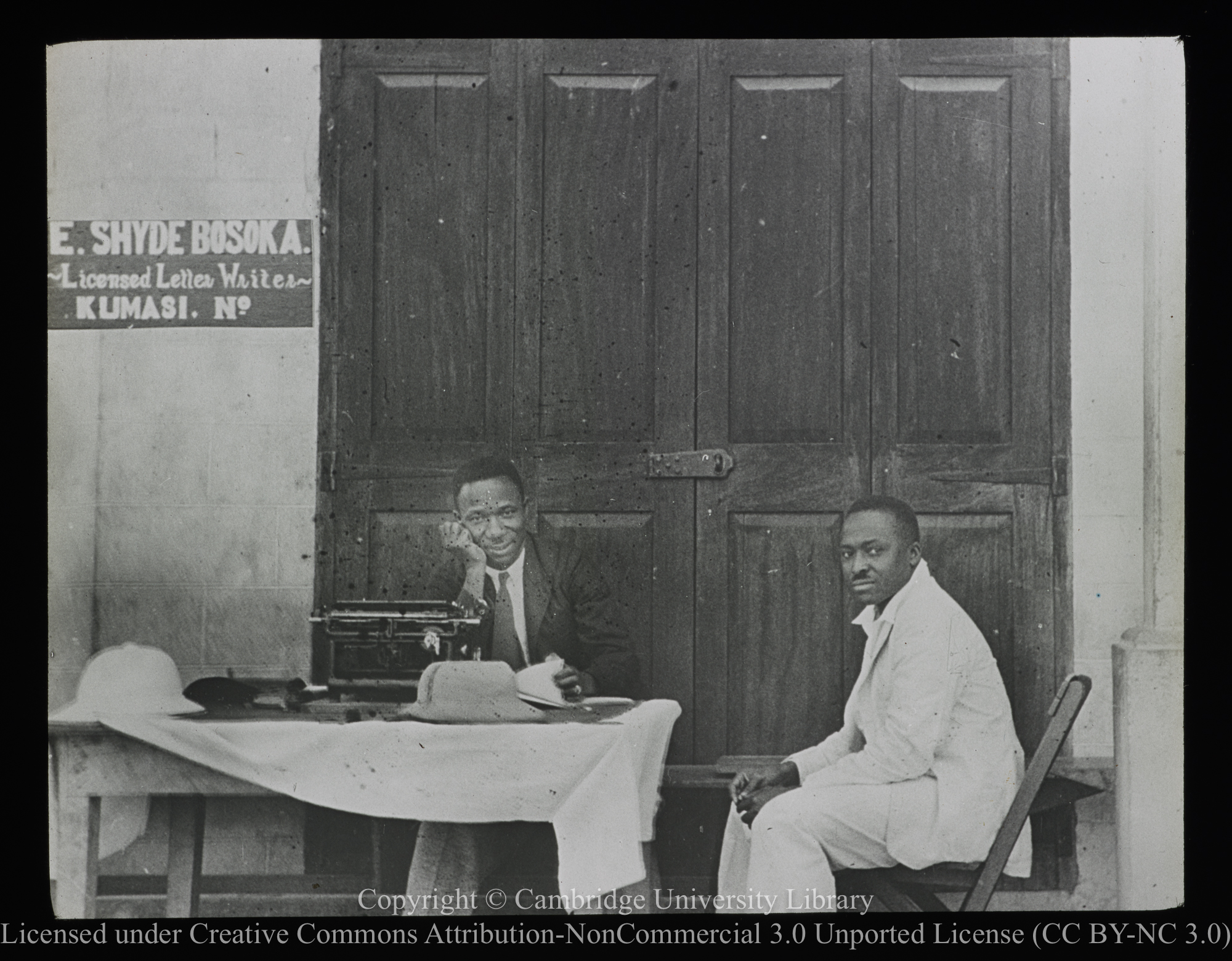 Licensed letter writer and client, Kumasi, Gold Coast [Ghana], 1900 - 1947