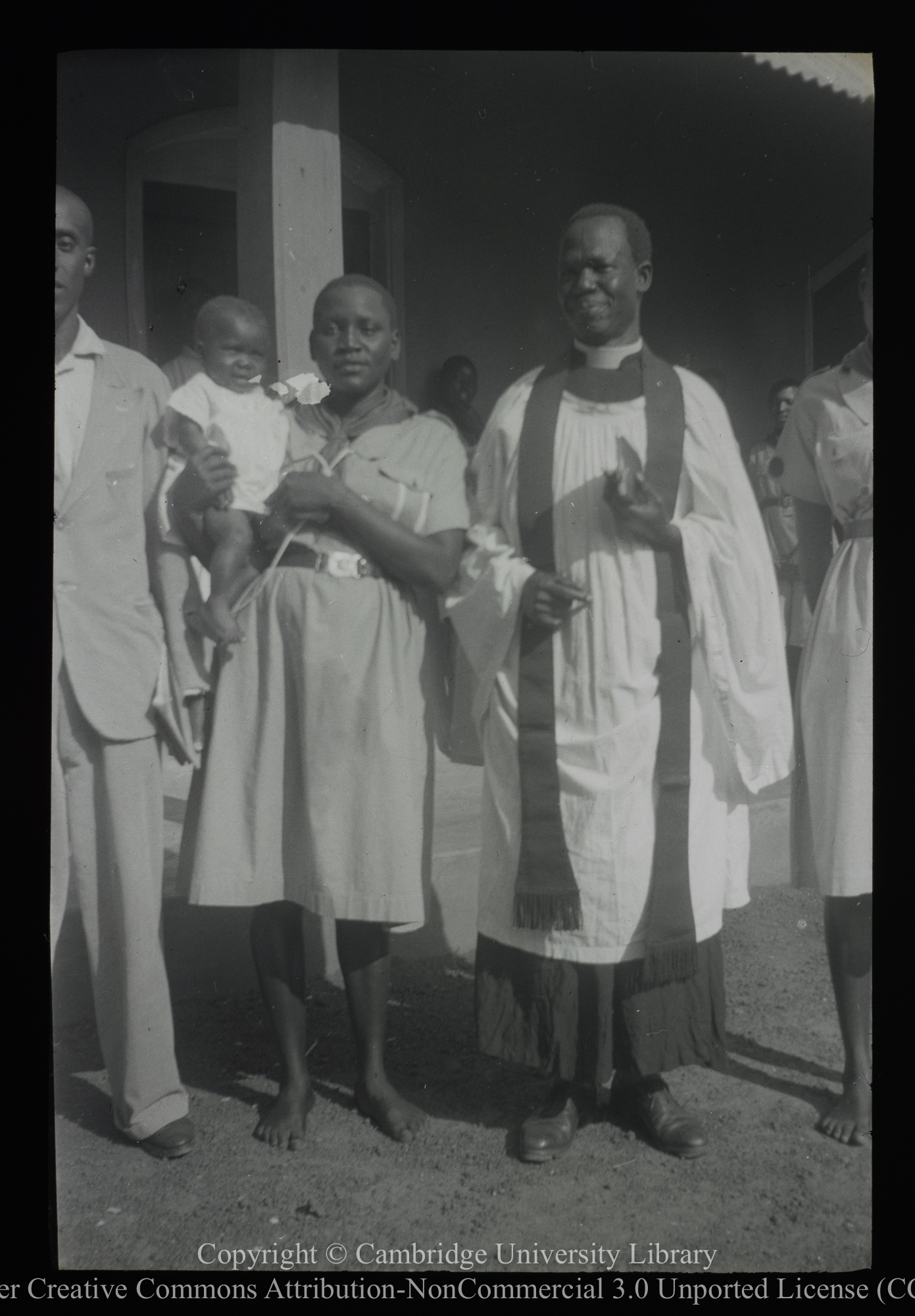 African clergyman with mother and child, 1929 - 1948