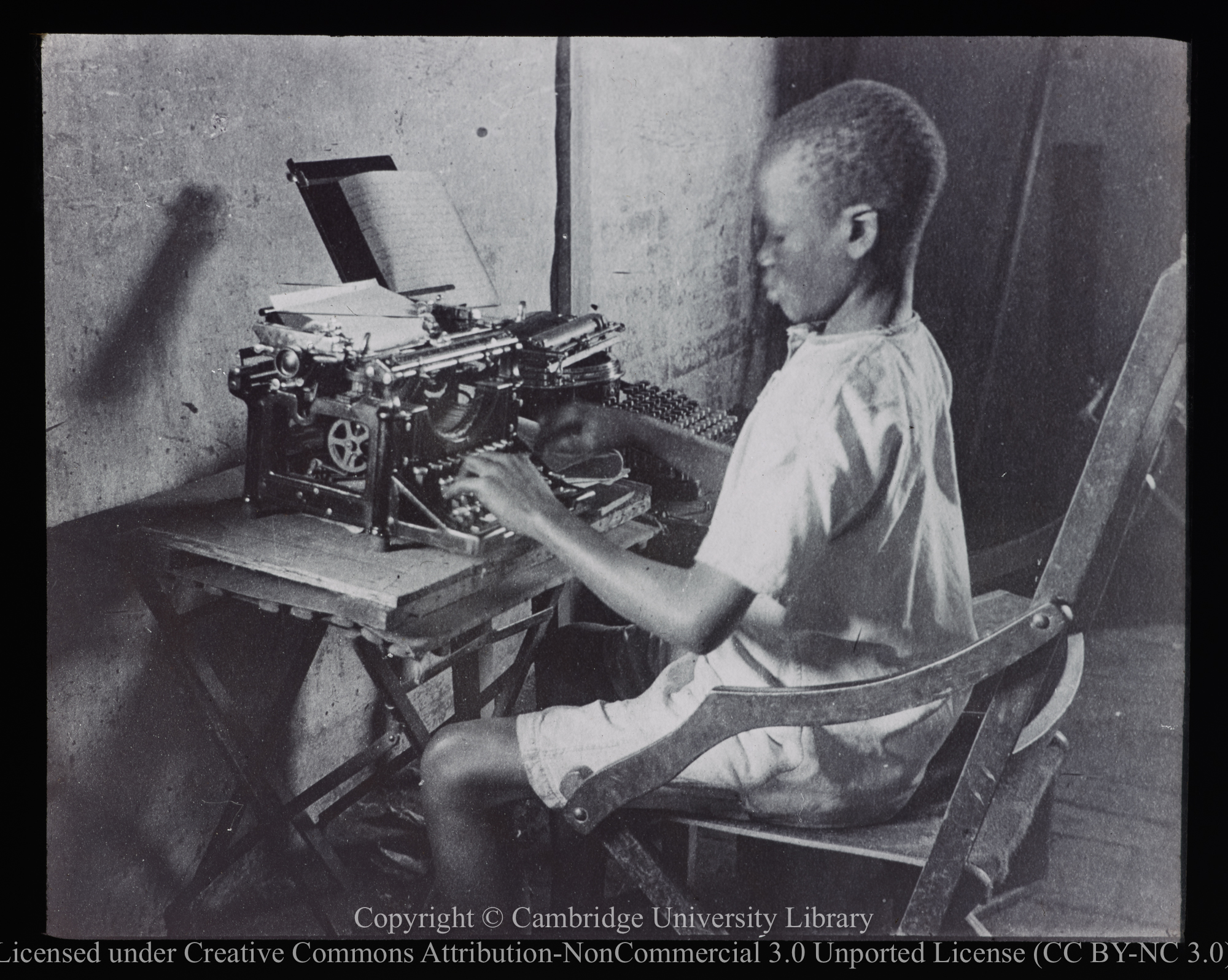 Youth at typewriter, 1905 - 1947