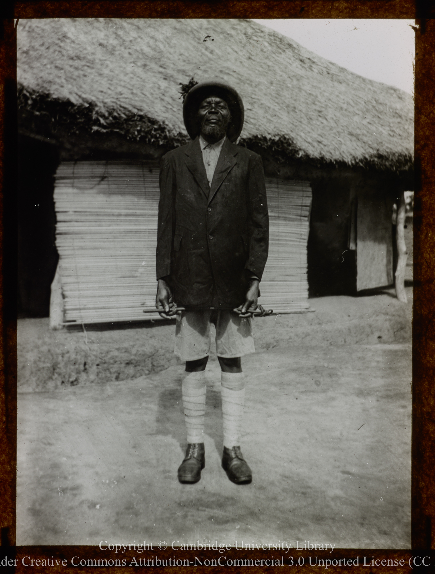 Kakua [Kakwa] chief, wearing sun helmet, jacket and shorts, 1892 - 1914