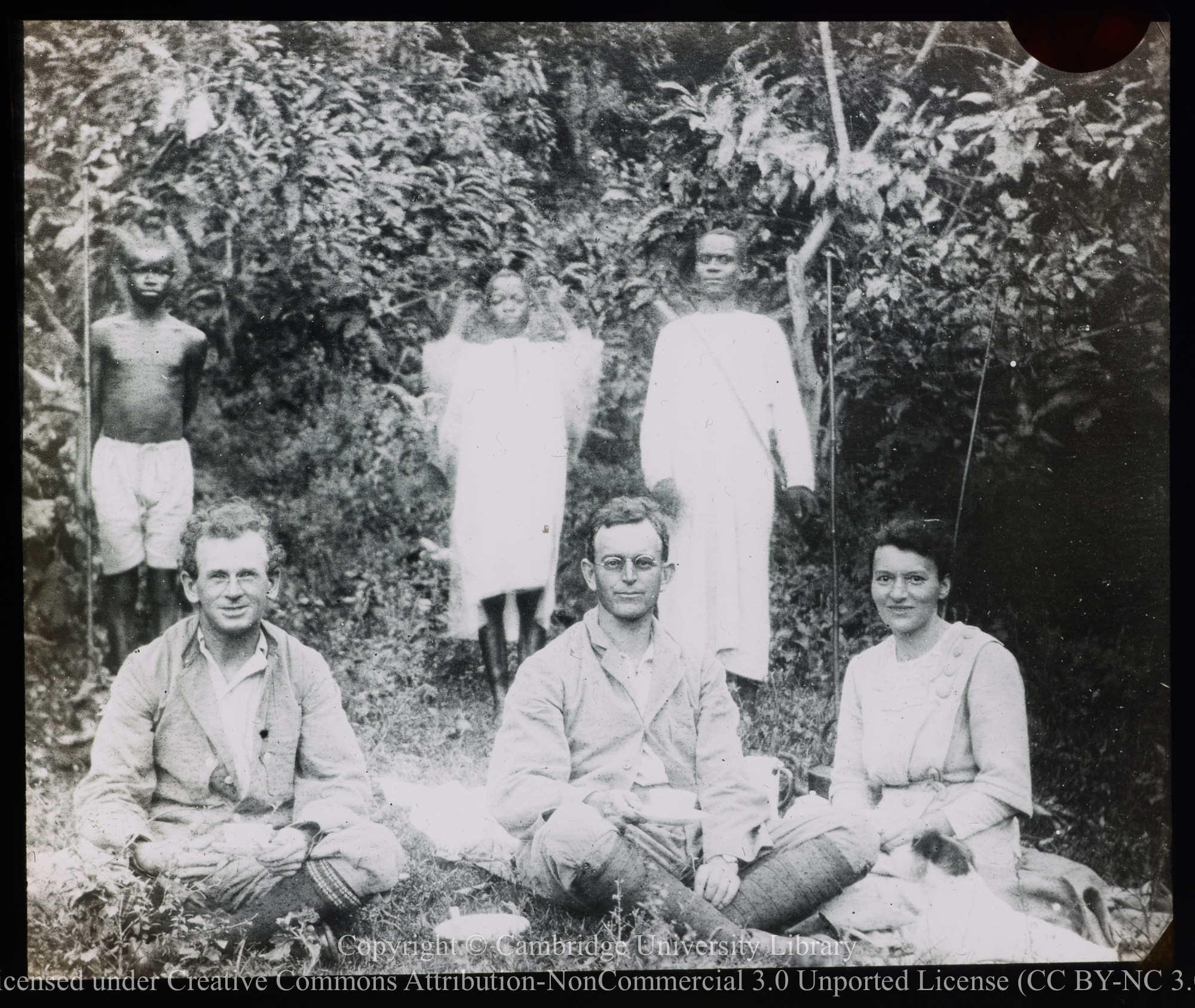 Canon K.St. A. Rogers, Rev. R. Banks and Mrs. Banks, seated in front of their guides, Upper Nile, 1915