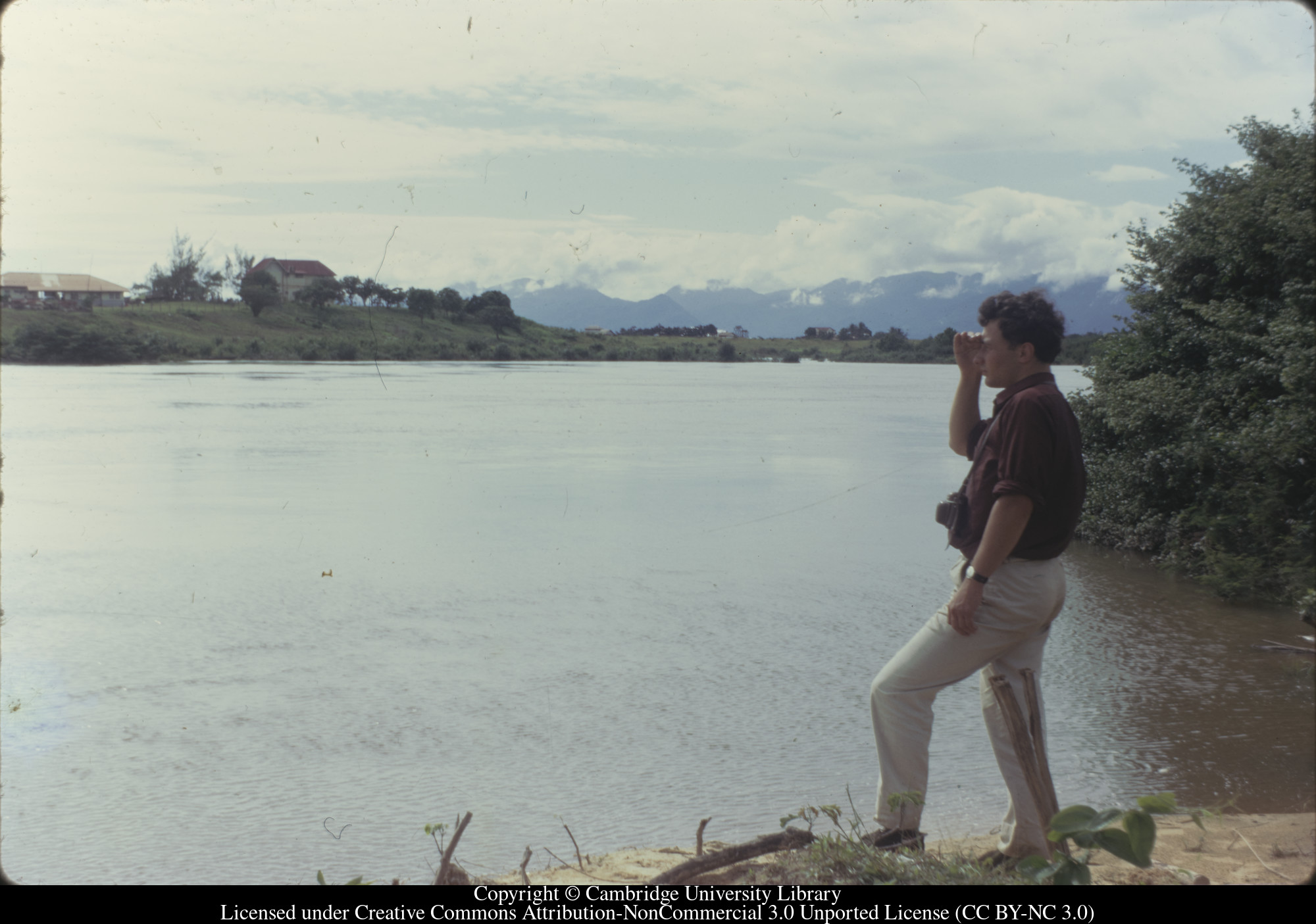 Brian in Brazil, looking back across River Takatu to Lethem, 1970