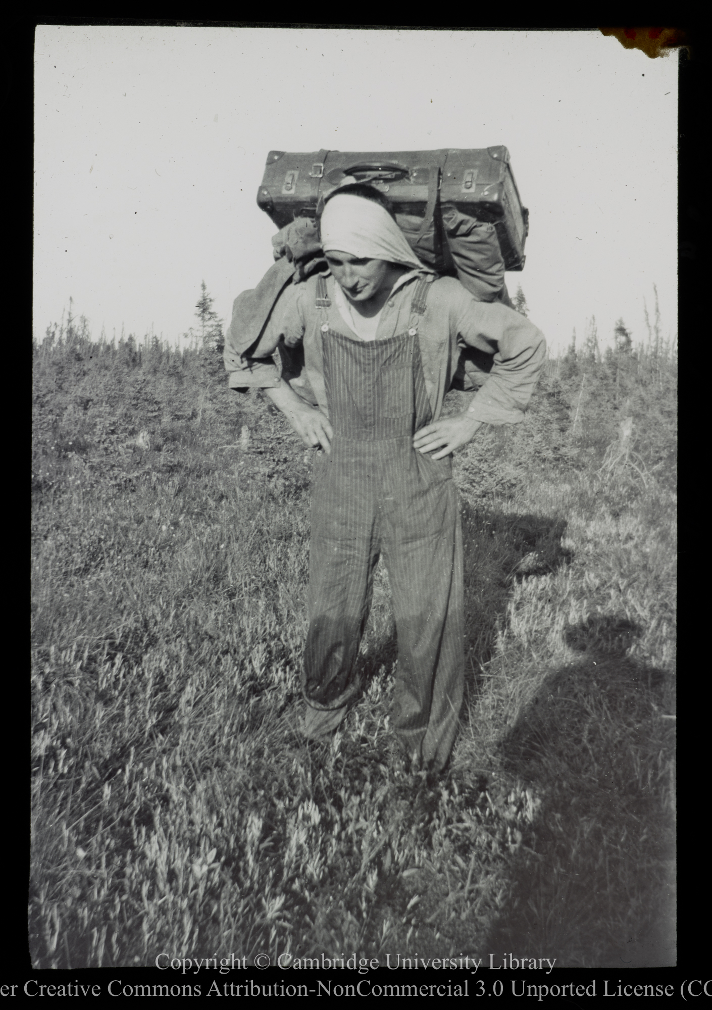 Athabasca, &#39;Packing&#39; luggage across portage, 1910 - 1930