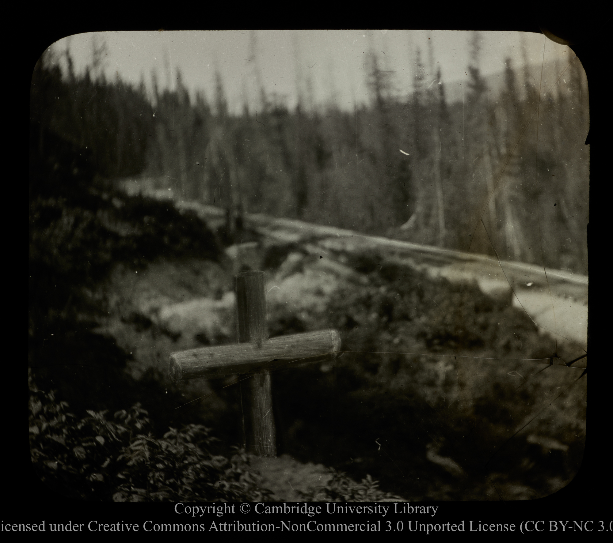 [Timber cross marking grave by side of railway], 1910 - 1930