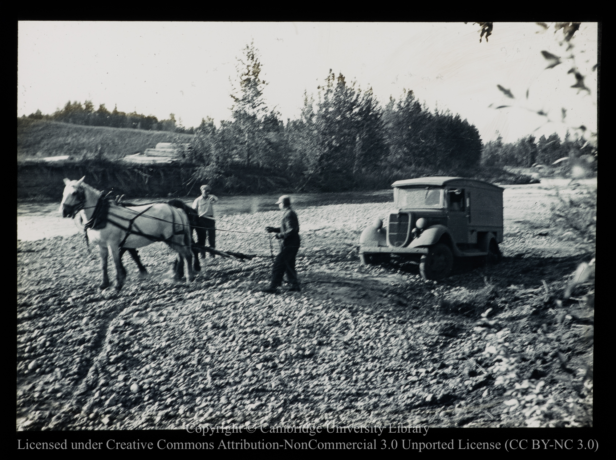 [Hauling a van from the mud with a horse], 1910 - 1930