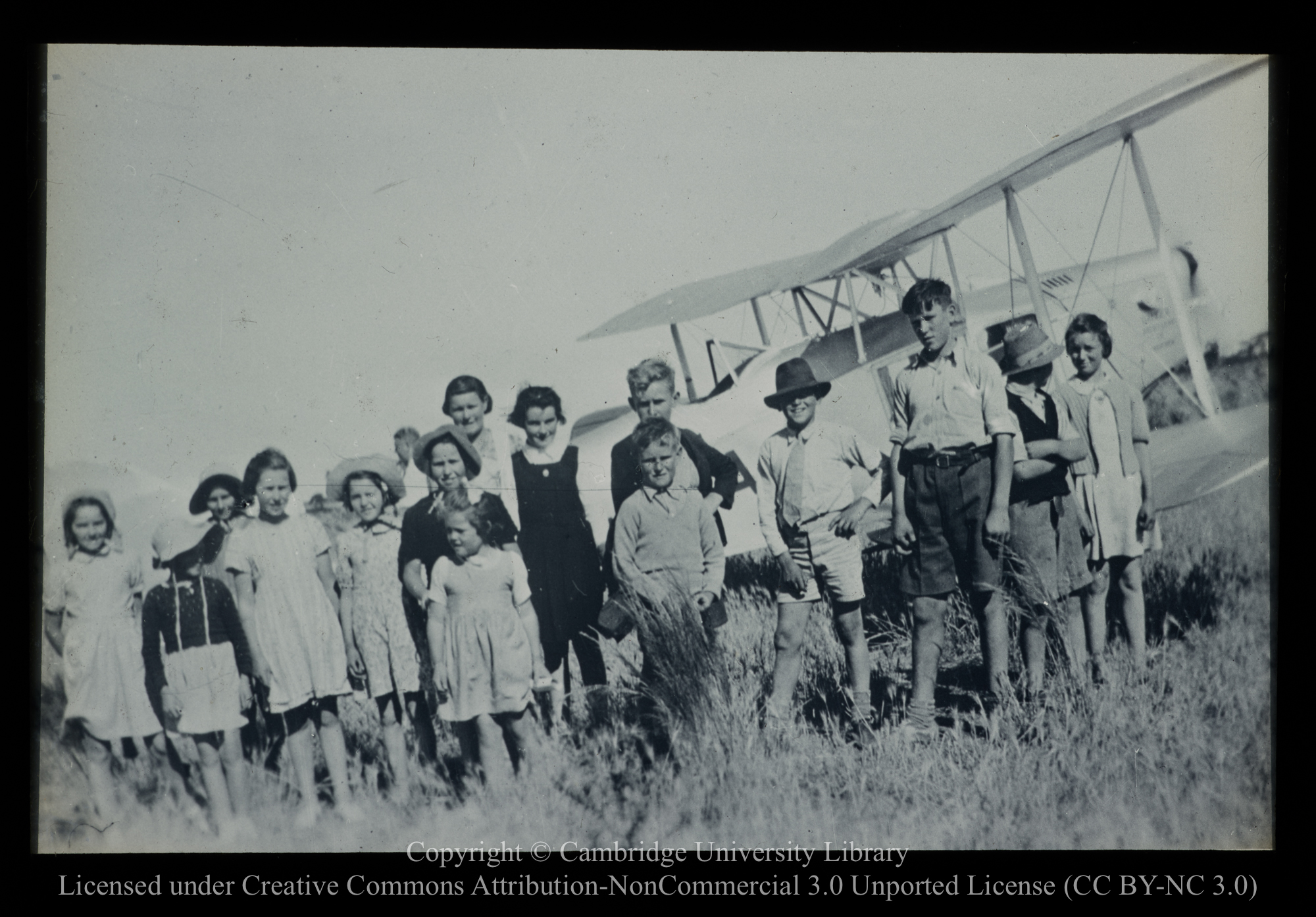 [Children by mission aircraft], 1910 - 1930