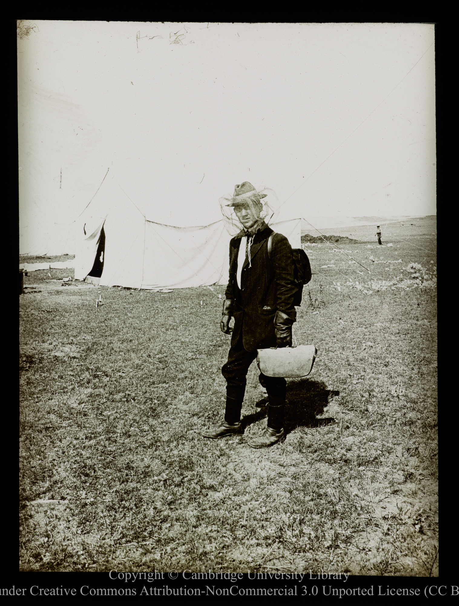 [Man wearing anti-mosquito headgear], 1910 - 1930